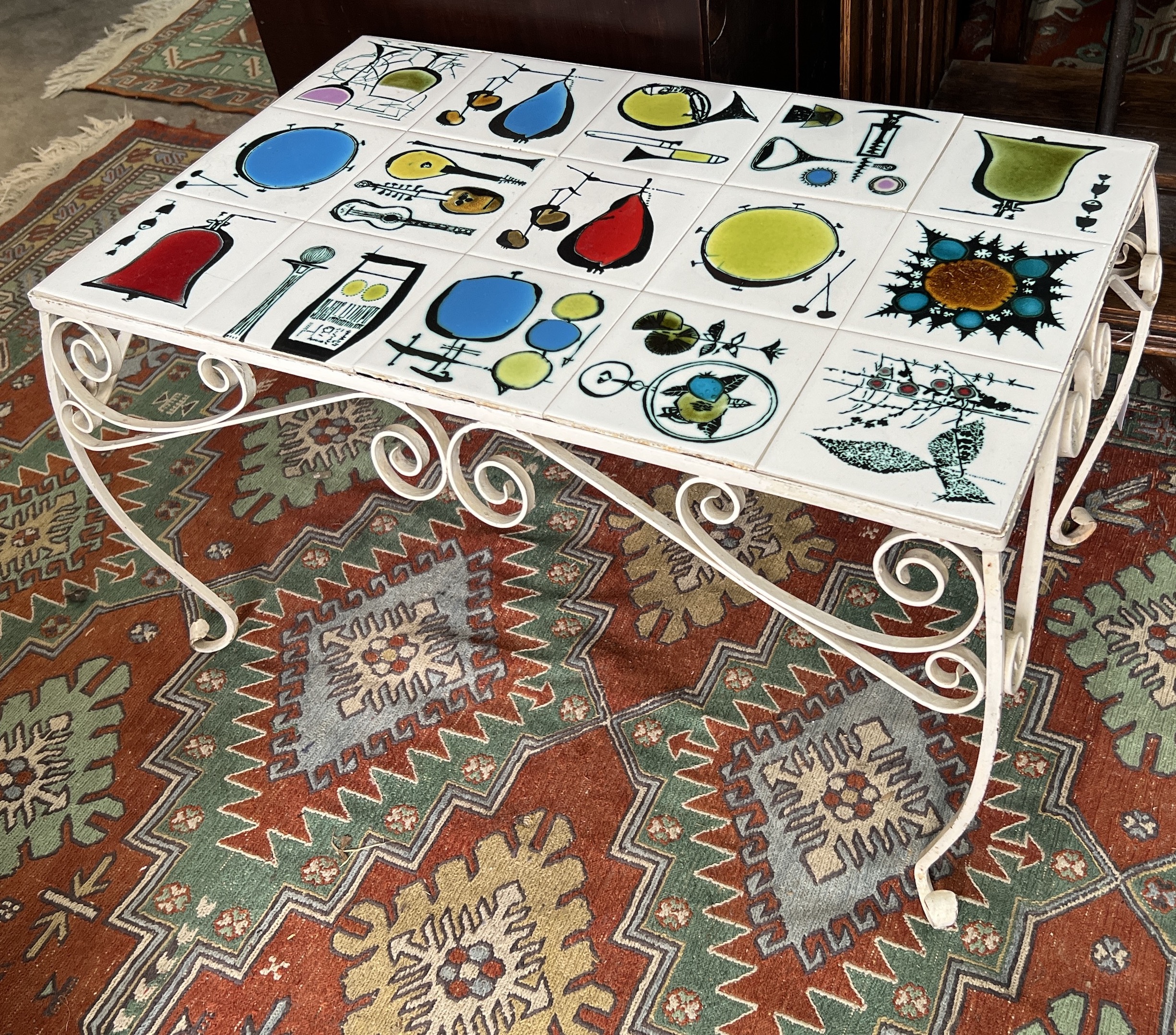 A mid century rectangular tile top wrought iron coffee table, width 79cm, depth 51cm, height 44cm